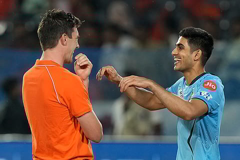 Shubman Gill chats with Pat Cummins
